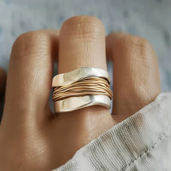 Silver ring with gold threads