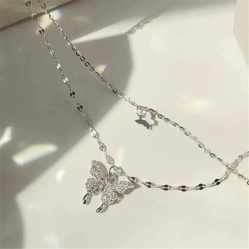 Silver necklace with glittering butterfly